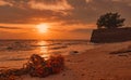 Garbage on the beach. Coastal environmental pollution. Marine environmental problems. Old rope on sand beach at sunset time Royalty Free Stock Photo