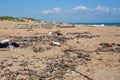 Garbage on the beach. Plastic garbage was carried out by a wave on a sandy shore. Ecological catastrophe Royalty Free Stock Photo