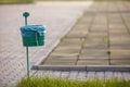 Garbage bin outdoor on blurred sunny background Royalty Free Stock Photo