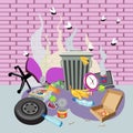 Garbage bin with unsorted waste next to a brick wall. Royalty Free Stock Photo