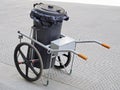 Garbage bin on wheels for road paving clean