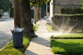 Garbage can at curb for trash pickup in urban neighborhood Royalty Free Stock Photo