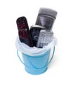 Garbage can filled with old cell phones Royalty Free Stock Photo