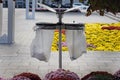 Garbage can with lid and trash bag holders.