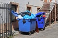 Garbage cans on the backyard of an old industrial building Royalty Free Stock Photo