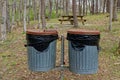 Garbage cans and picnic tables in a park