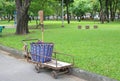 Garbage Cart in the garden. Royalty Free Stock Photo