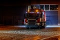 Garbage collecting truck leaves garage to collect garbage. Royalty Free Stock Photo