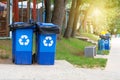 Garbage collection. Blue containers for further processing of garbage. Waste recycling concept. Sunshine Royalty Free Stock Photo
