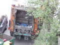 Garbage collection in the city courtyard by car