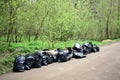 Garbage collection in plastic bags on a forest road. Cleaning garbage in the forest is a sign of love for nature Royalty Free Stock Photo