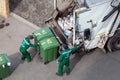 Garbage collection workers collect solid waste