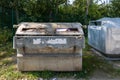 Garbage container: Large container for waste paper and green glass Royalty Free Stock Photo