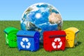 Garbage containers around Earth Globe in green grass against blu Royalty Free Stock Photo