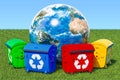 Garbage containers around Earth Globe in green grass against blu