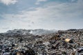 Garbage dump area view full of smoke, litter, plastic bottles, rubbish and trash at the Thilafushi local tropical island Royalty Free Stock Photo