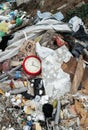 Garbage dump. Broken clock in the garbage
