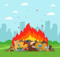 Garbage dump is burning on the background of the city. improper waste disposal.