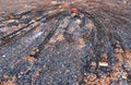 Garbage dump with waste plastic, polyethylene and food waste. Trash disposal for recycling and re-use. Bulldozer at landfill