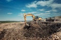 Garbage dumpsite - excavation works with heavy duty machinery Royalty Free Stock Photo