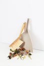 Garbage in the dustpan. Cleaning the room from garbage. Dustpan and brush on a white background. The concept of