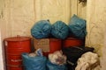 Garbage in fireproof garbage room protected by water sprinkler system segregated according categories and separated