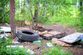 Garbage in forest. People illegally thrown garbage into forest. Concept of man and nature. Royalty Free Stock Photo