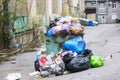 Garbage heap in a container in the yard of the house. The problem of ecology in cities