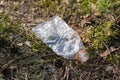 Garbage left in the forest. Plastic bottles littering forest are Royalty Free Stock Photo