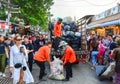 Bangkok, Thailand -  September 29, 2018 :  garbage man collecting garbage to the truck among crowd of tourist and people Royalty Free Stock Photo