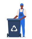 Garbage man in uniform with black trash bin and recycling symbol on it. Garbage sorting. Zero waste, environment protection Royalty Free Stock Photo
