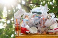 Garbage many close-up on Trash full of trash bin, Plastic bag waste Lots of junk on nature tree sunshine background