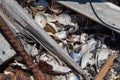 Garbage with metal, wood, shells on bonfire