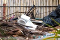 Garbage and other waste on the streets of the tropical island. The toilet is next to the pedestrian walkway. Nature killing