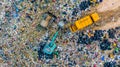 Garbage pile in trash dump or landfill, Aerial view garbage trucks unload garbage to a landfill, global warming