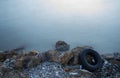 Garbage, plastic, wood,shell and wheel on the beach Royalty Free Stock Photo