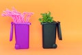 Garbage pot full of plastic straws and other with a green natural plant on an orange background.