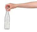 Garbage recycling concept. Female hand holding empty glass drink bottle isolated on white Royalty Free Stock Photo