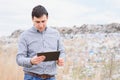 Garbage recycling concept. man on dumpster. Keeping the environment clean. Ecological problems Royalty Free Stock Photo