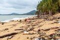 Garbage on sea beach, dirty ocean water, environmental pollution, ecology, waste, rubbish, plastic, trash, refuse, litter Royalty Free Stock Photo