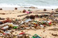 Garbage on sea beach, dirty ocean water, environmental pollution, ecology, waste, rubbish, plastic, trash, refuse, litter Royalty Free Stock Photo