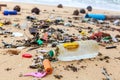 Garbage on sea beach, dirty ocean water, environmental pollution, ecology, waste, rubbish, plastic, trash, refuse, litter Royalty Free Stock Photo