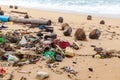 Garbage on sea beach, dirty ocean water, environmental pollution, ecology, waste, rubbish, plastic, trash, refuse, litter Royalty Free Stock Photo