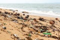 Garbage on sea beach, dirty ocean water, environmental pollution, ecology, waste, rubbish, plastic, trash, refuse, litter Royalty Free Stock Photo