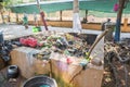 Garbage sharp Fragments of materials destroyed the construction of food waste, old clothes were dropped along the flow. Piles befo