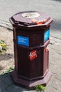 Garbage street bin with Emmanuel Macron sticker
