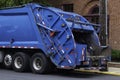 garbage truck collecting trash garbage truck keeping garbage on urban street Royalty Free Stock Photo