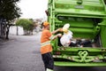 Garbage truck, dirt and man with collection service on street in city for public environment cleaning. Junk, recycling