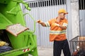 Garbage truck, dirt and worker with collection service on street in city for public environment cleaning. Junk Royalty Free Stock Photo