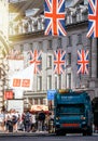 Garbage truck dustcart under Union Jack Flags on Regent Street